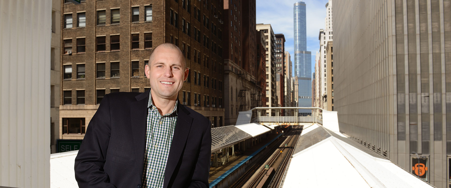 man standing in front of buildings