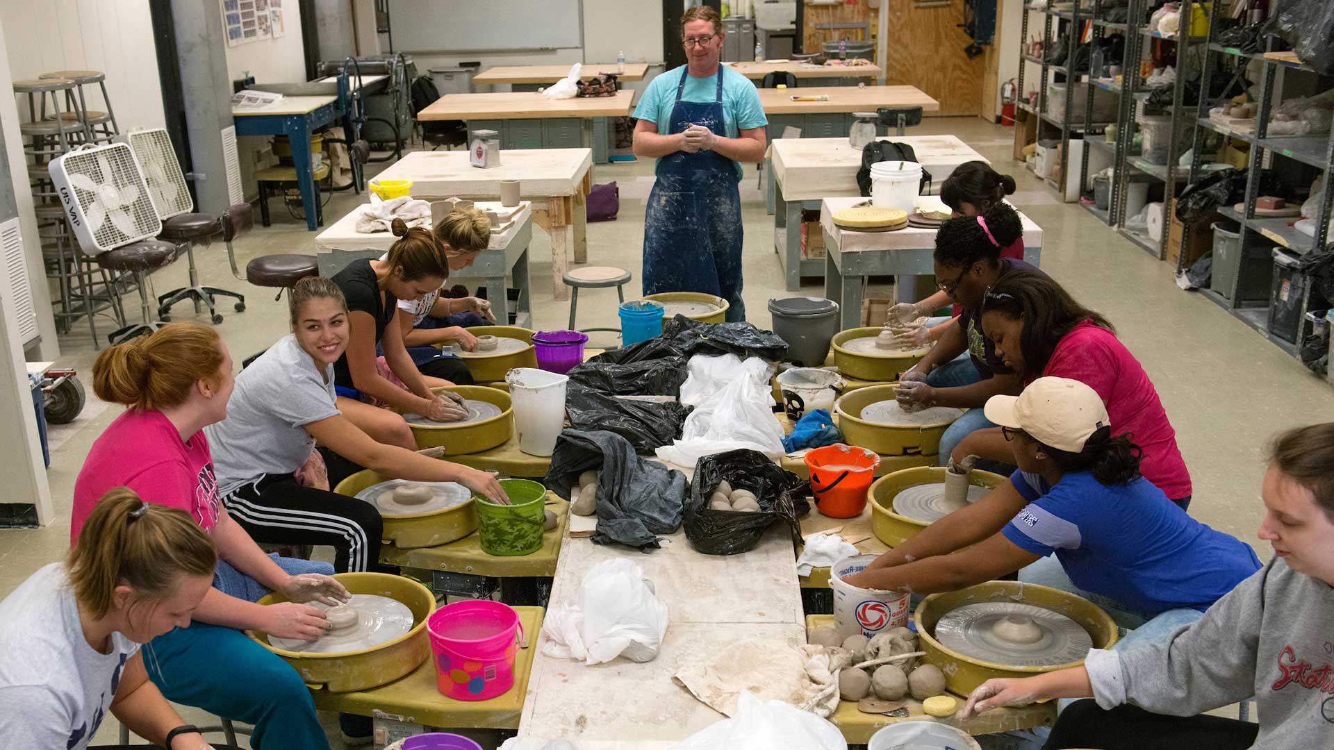 Professor Harris teaching a ceramics class