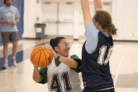 students playing basketball