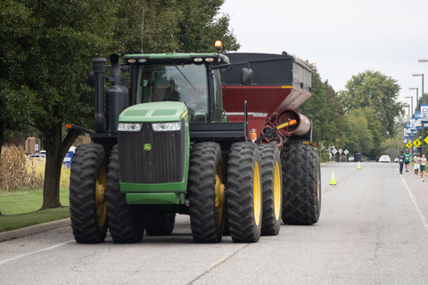 a large tractor driving through campus