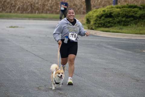 a racer running with their dog