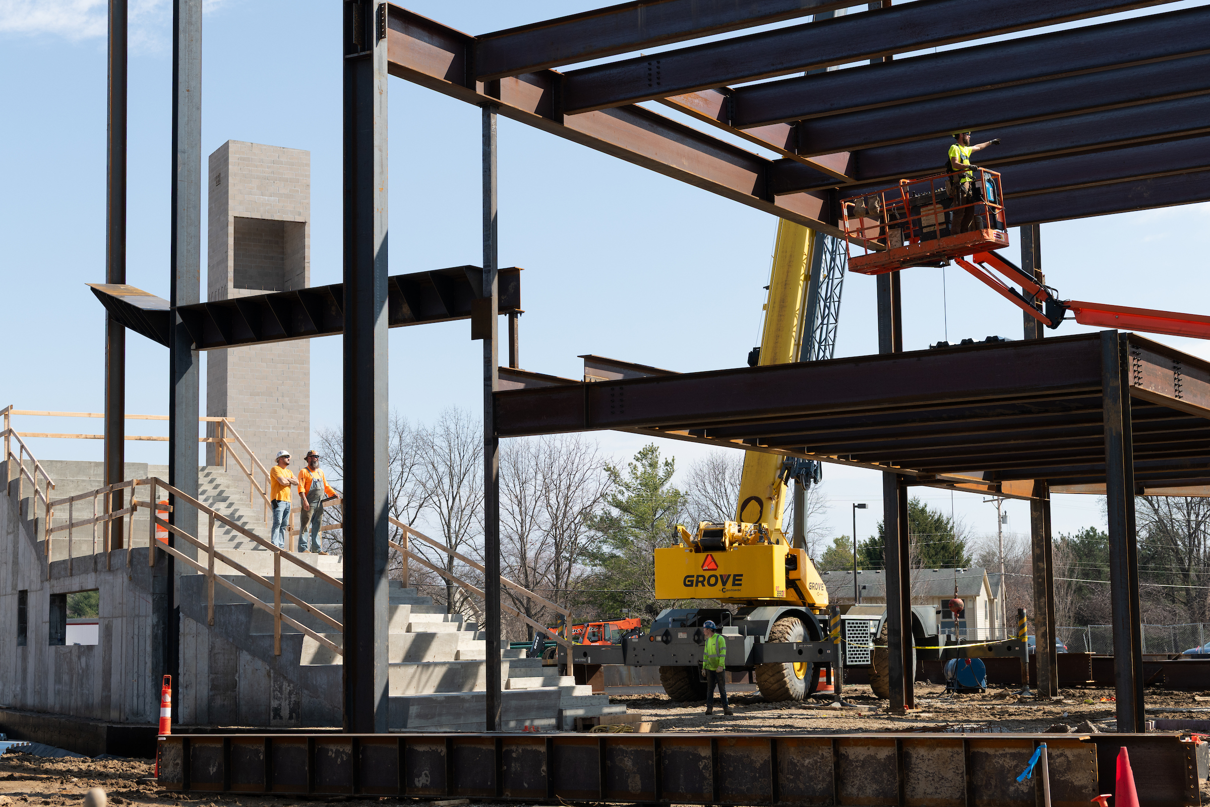 Construction crew installing steel beams to Library Commons.