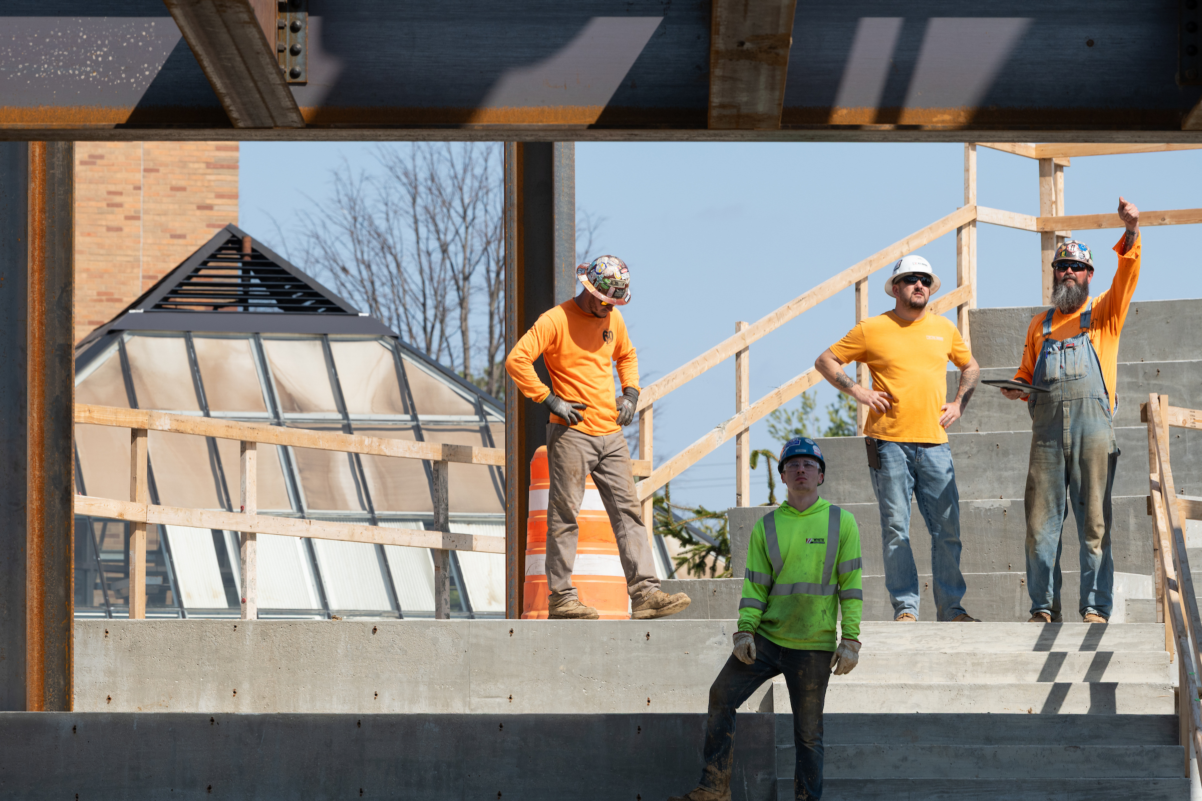 Construction crew analyzing their work on Library Commons.