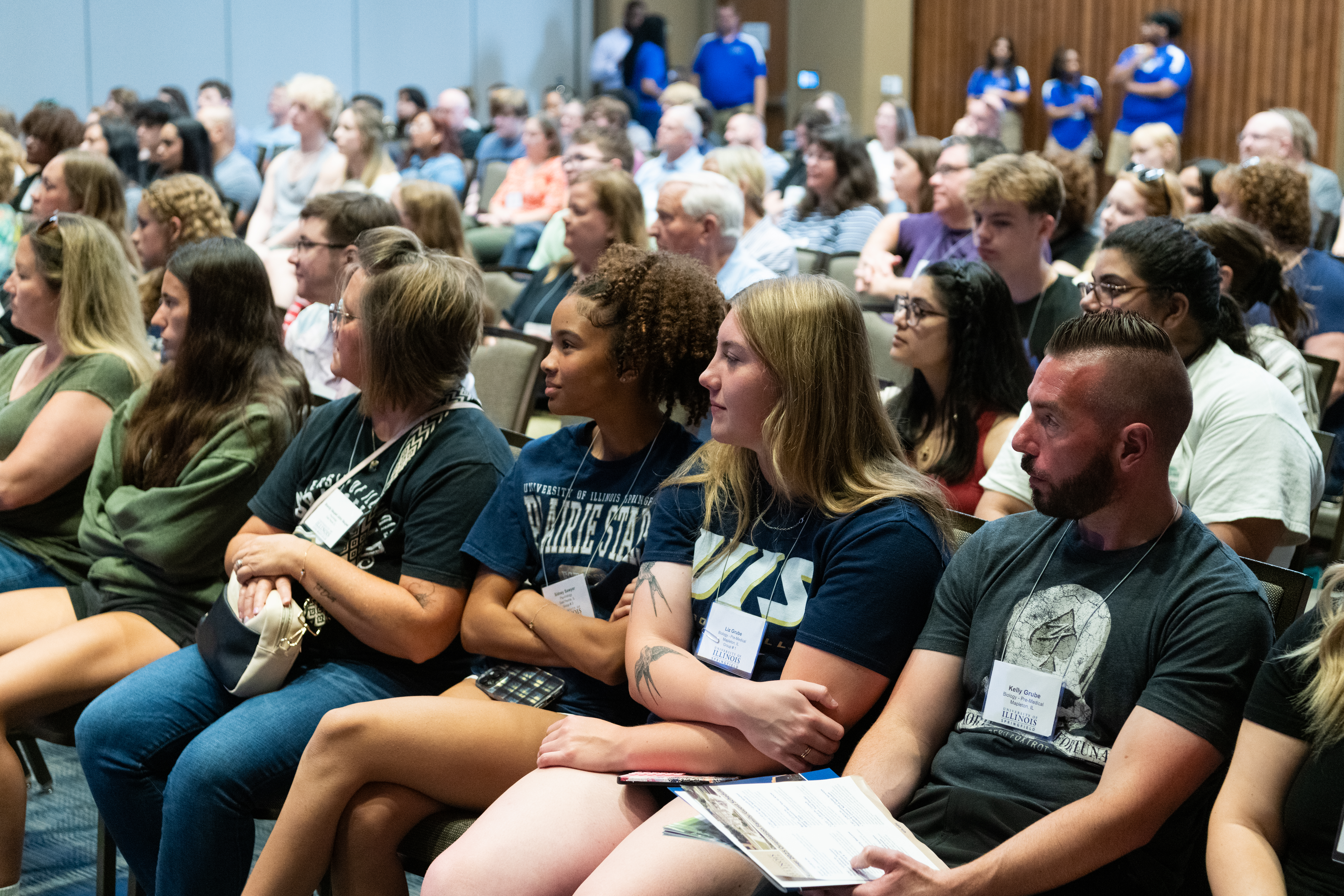 New students sitting at orientation.