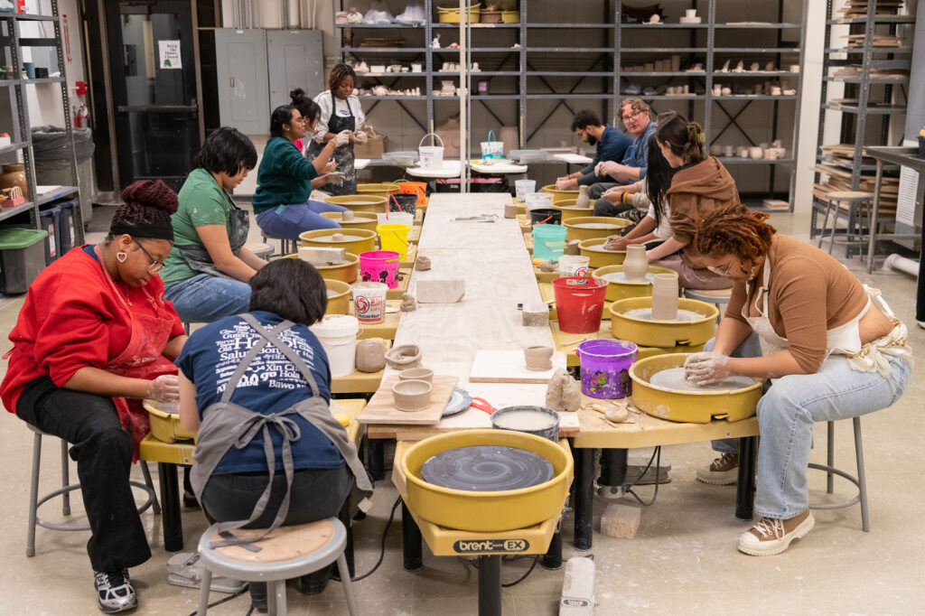 Professor Harris teaching a ceramics class