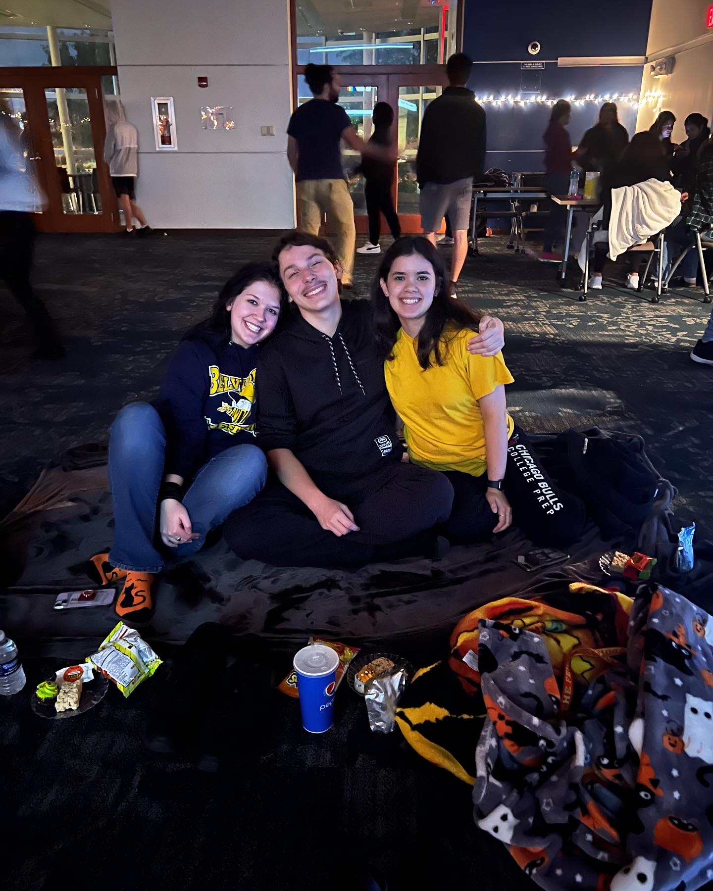 Three students watching a movie.