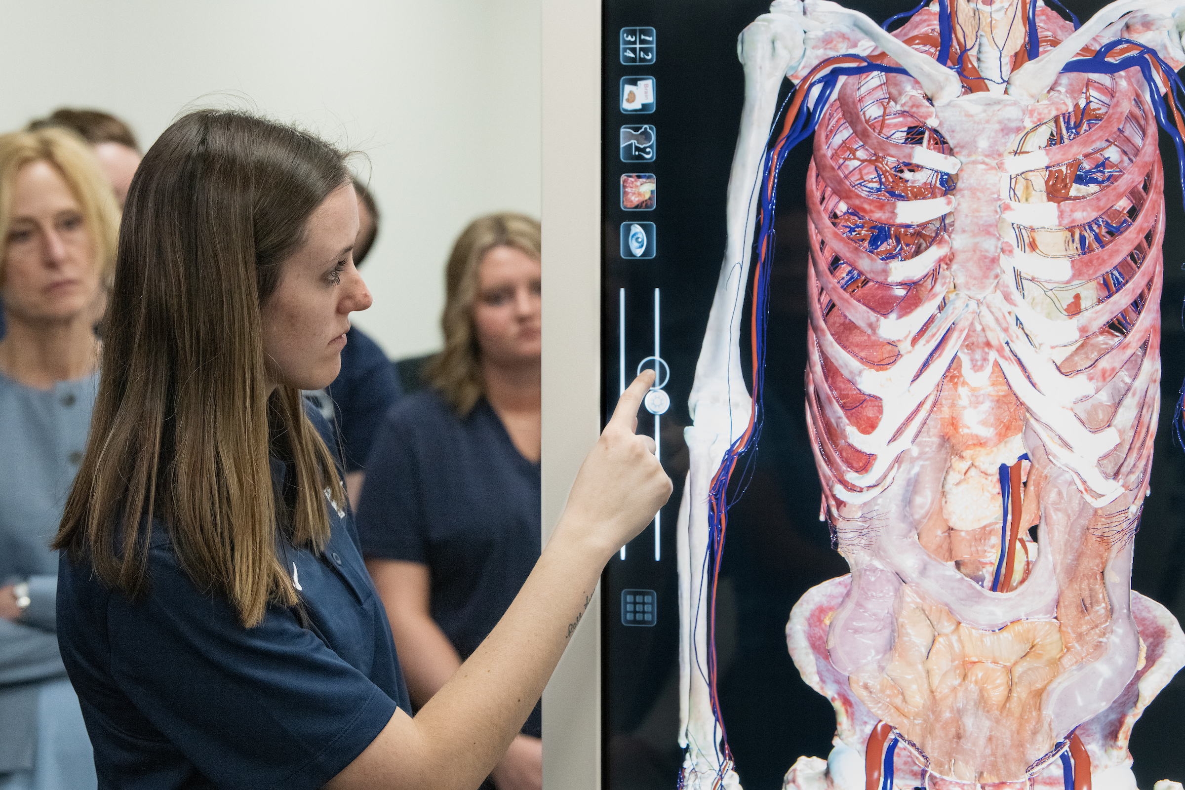 student demonstrating Anatomage table
