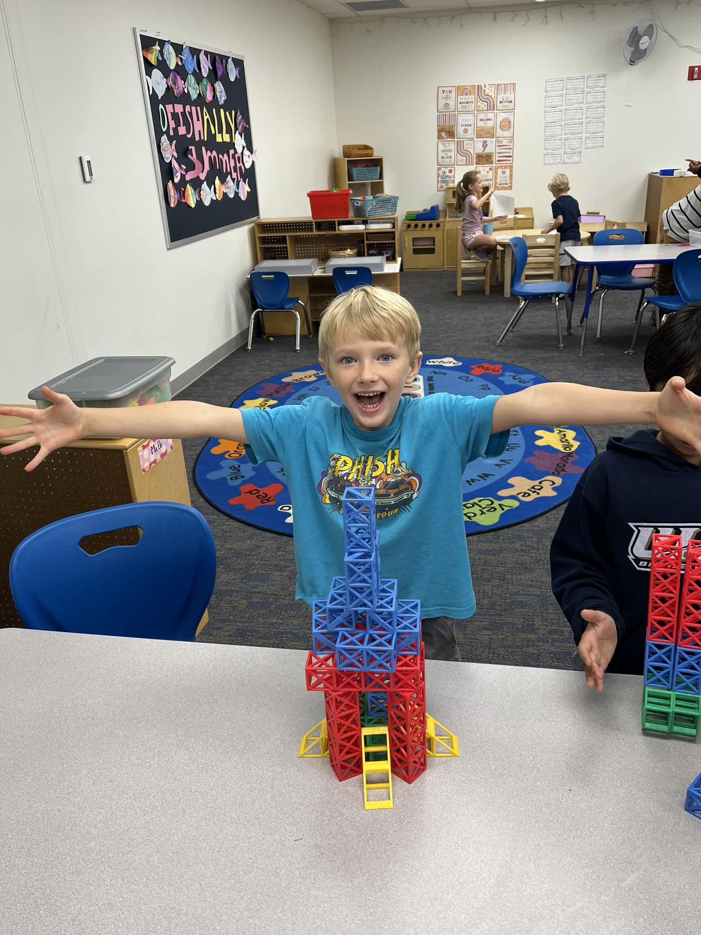 child with a building toy