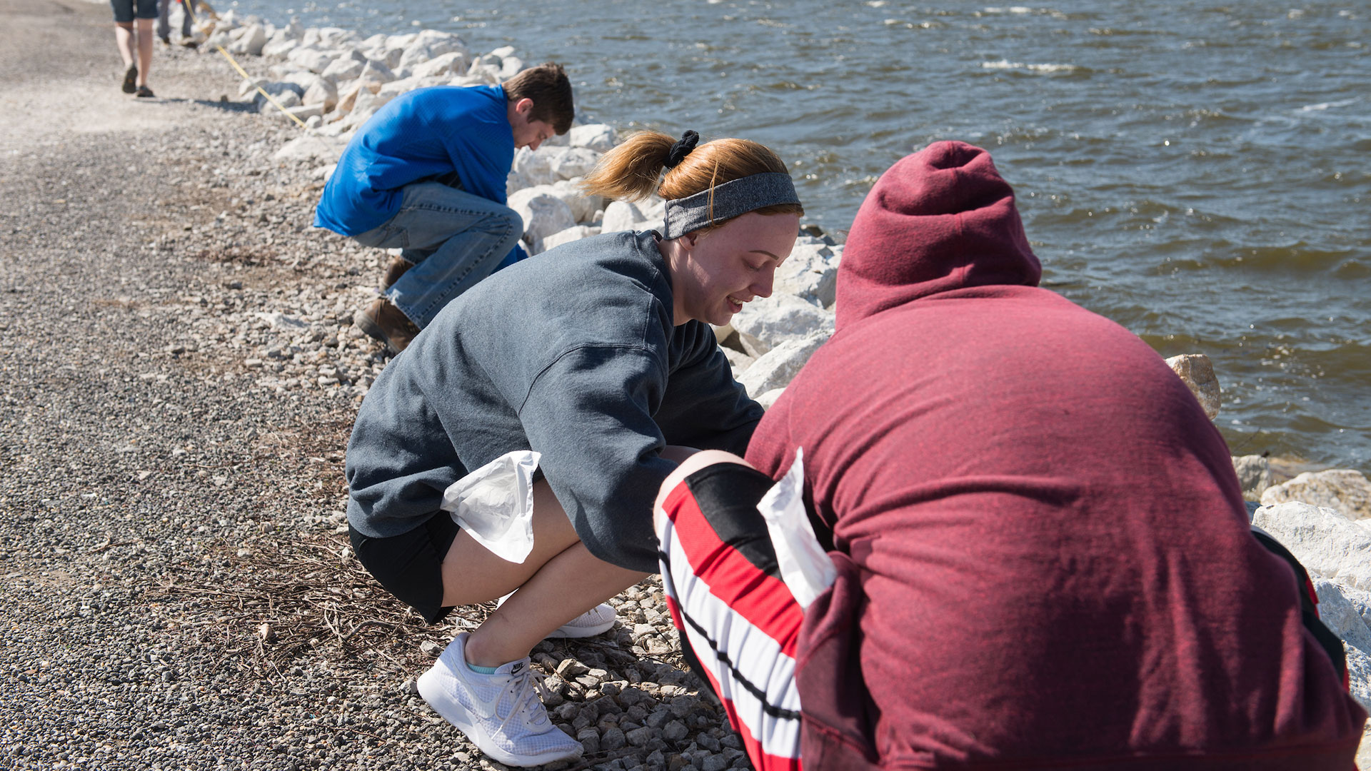 students working at the Field Station by the lake