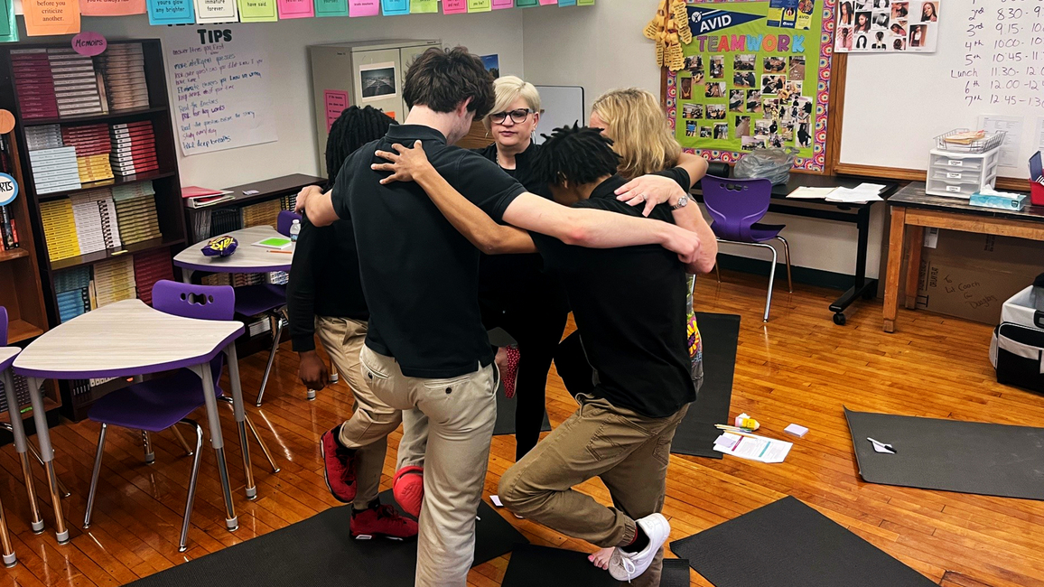 Jennifer Martin teaches students yoga