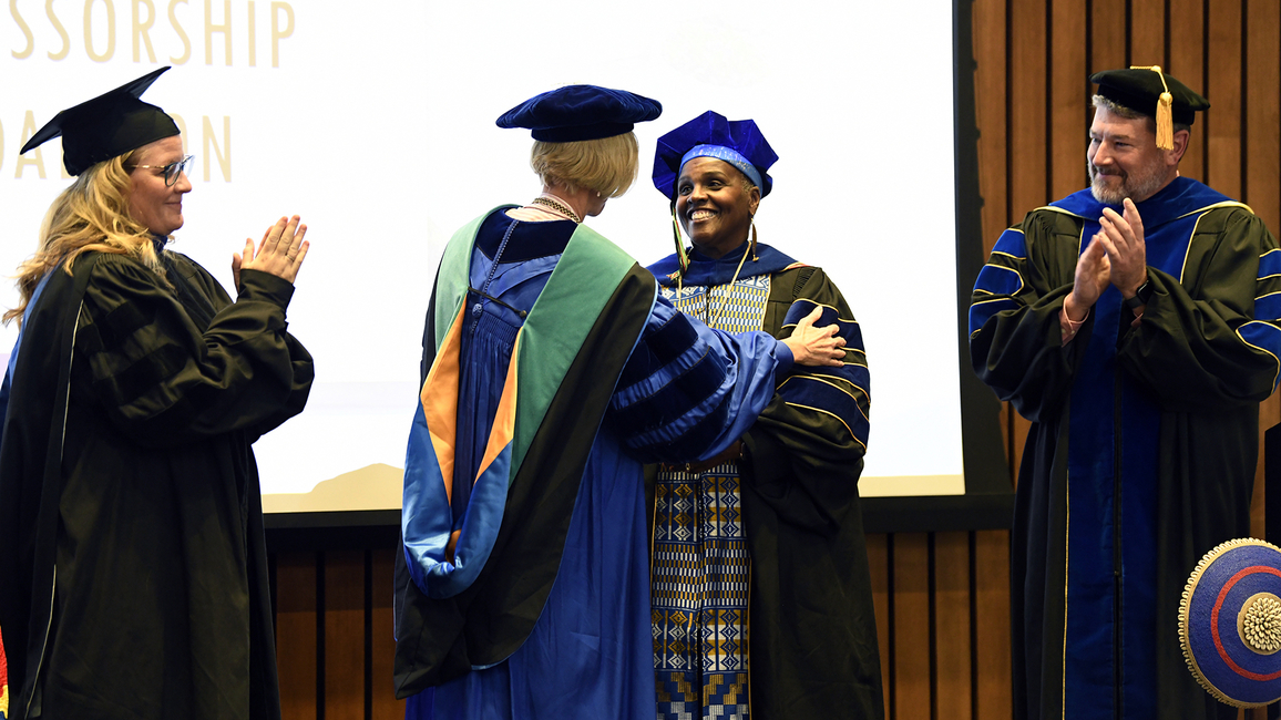 Hoff receives the Presidential Professor medallion.