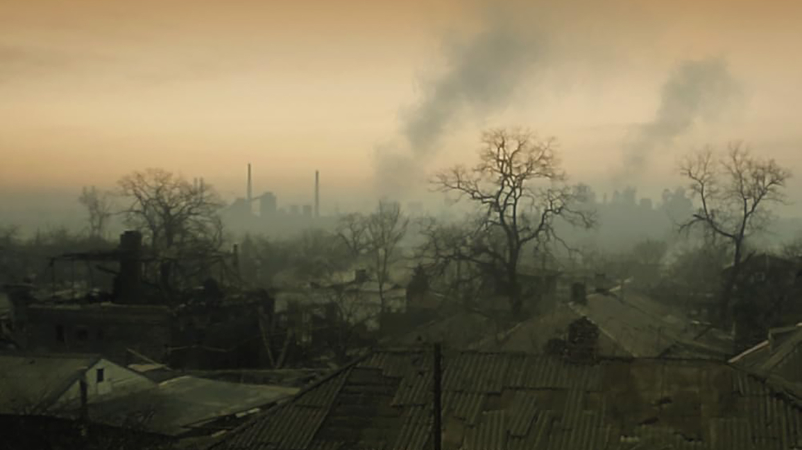 Mariupol, Ukraine is shown with smoke visible in the distance. 