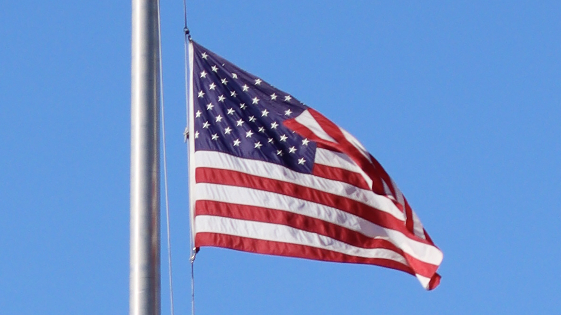 An American flag on a flagpole 