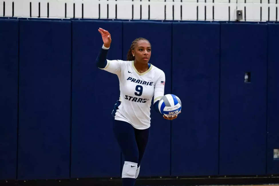 Erica Sledge prepares to serve