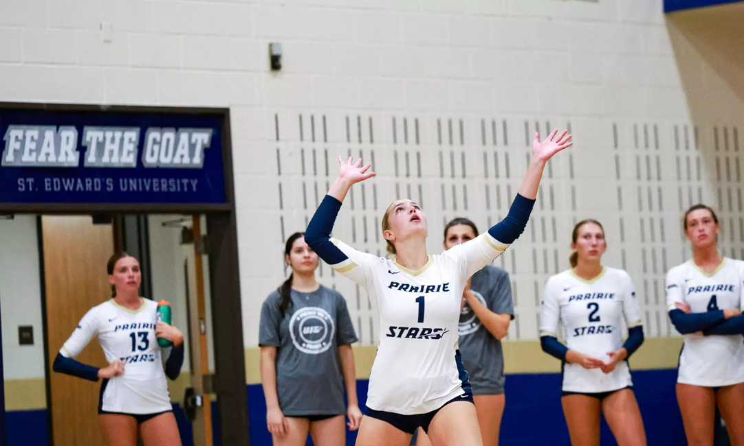 UIS volleyball player serves