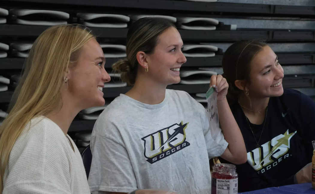 UIS women's soccer atheltes pose for photo during PBJ Springfield event