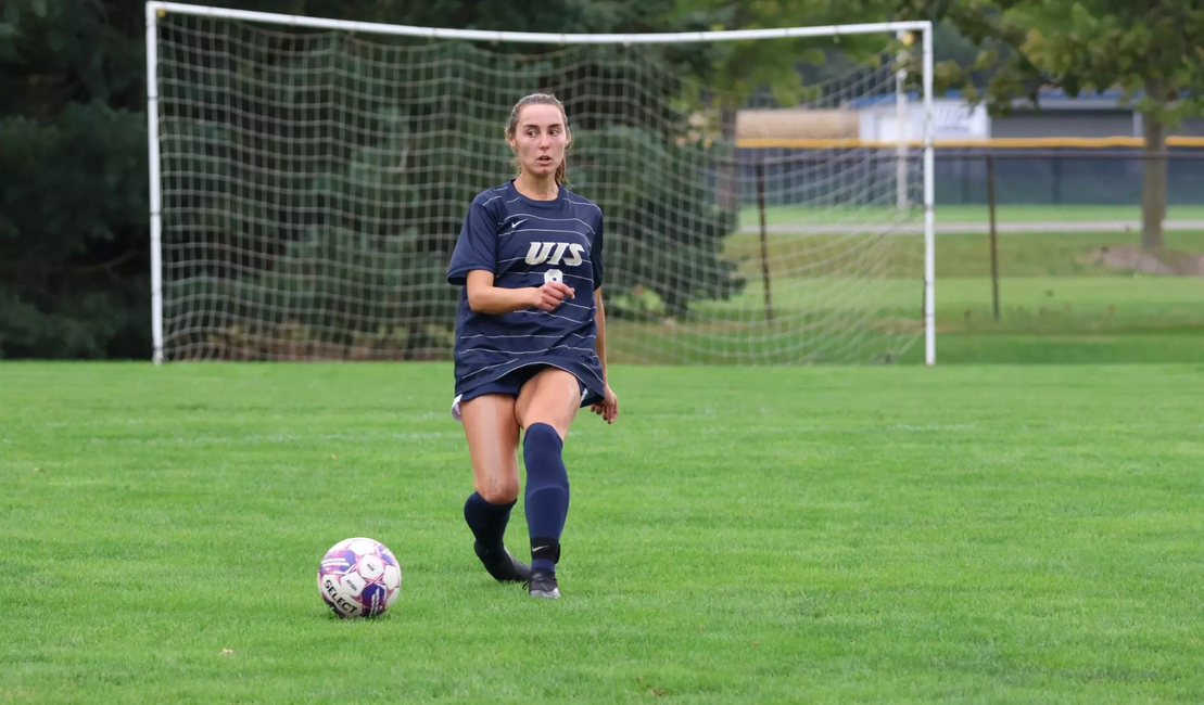 Megan Little playing the ball forward