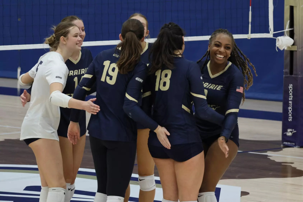 Volleyball team celebrating a point