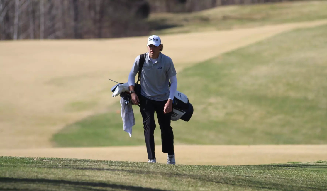 Julien Babineau with his golf clubs