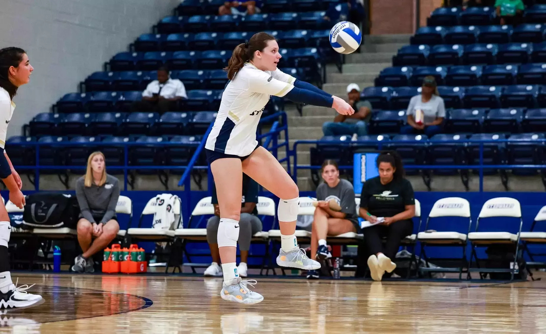 Makenna Cox passing a volleyball