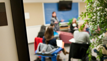 people in room speaking