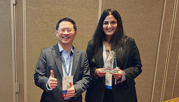 Brian Chen and Zainab Yaseen pose with the award.