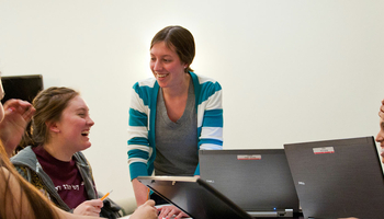 students and professor talking