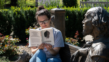 student reading book