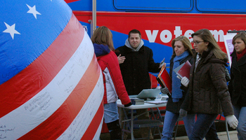 students in voting booth