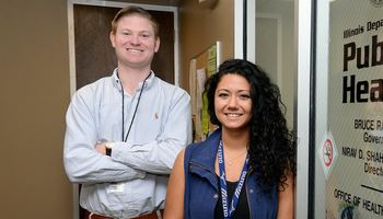 students in front of public health sign