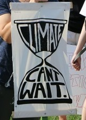 Dr. Brandon Derman and Dr. Megan Styles, Environemtnal Studies faculty, at a climate protest on the Quad in 2019
