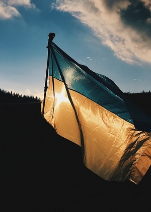 Photo of Ukrainian flag backlit by the sun