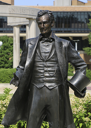 The Abraham Lincoln statue at UIS with the colonnade in the background.