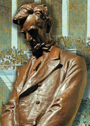 A bronze statue of Abraham Lincoln looking down.