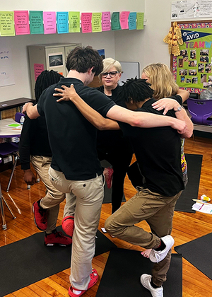 Jennifer Martin teaches students yoga