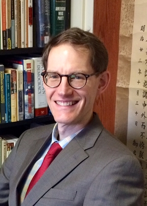 Dr. Graham Peck sitting in an office, smiling.