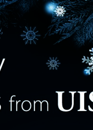 Dark holiday card with snowflakes and "Happy Holidays from UIS" text.