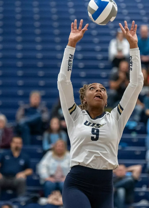 Erica Sledge setting the ball