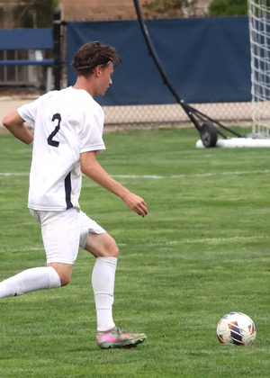 Lennard Borgs playing soccer at UIS in white uniform