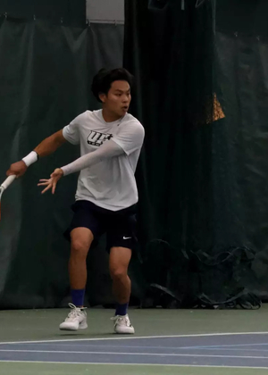 Lin En Tan playing tennis at UIS