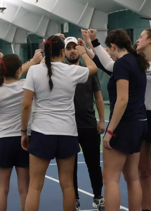 UIS women's tennis team huddle