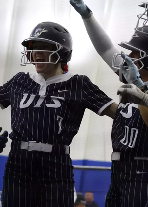 Softball celebrating a homerun