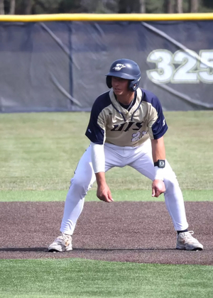 Chris Suchoski base running in golf UIS baseball uniform