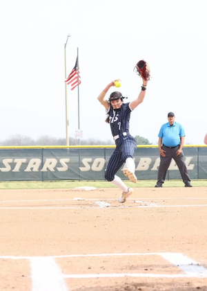Rosie Bartletti pitching in blue UIS uniform at UIS Softball Field