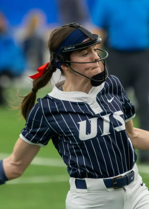 Rosie Bartletti pitching in blue UIS uniform