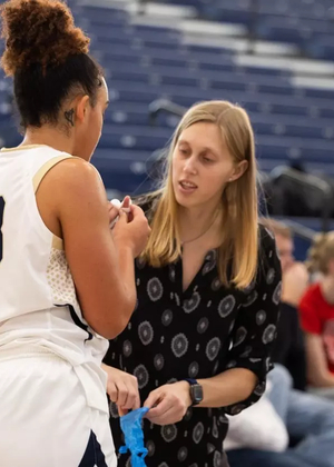 Abby Kain, athletic trainer attending to a student-athlete