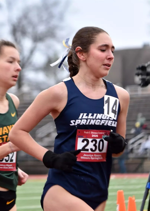Josslyn Gaona running outdoor track in blue uis uniform