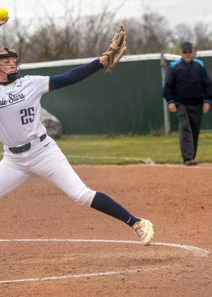 Calista Stahlhut pitching in white UIS uniform