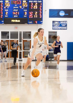 Julia Mingus dribbles down the court