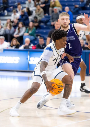 Jorden Williams playing basketball at UIS